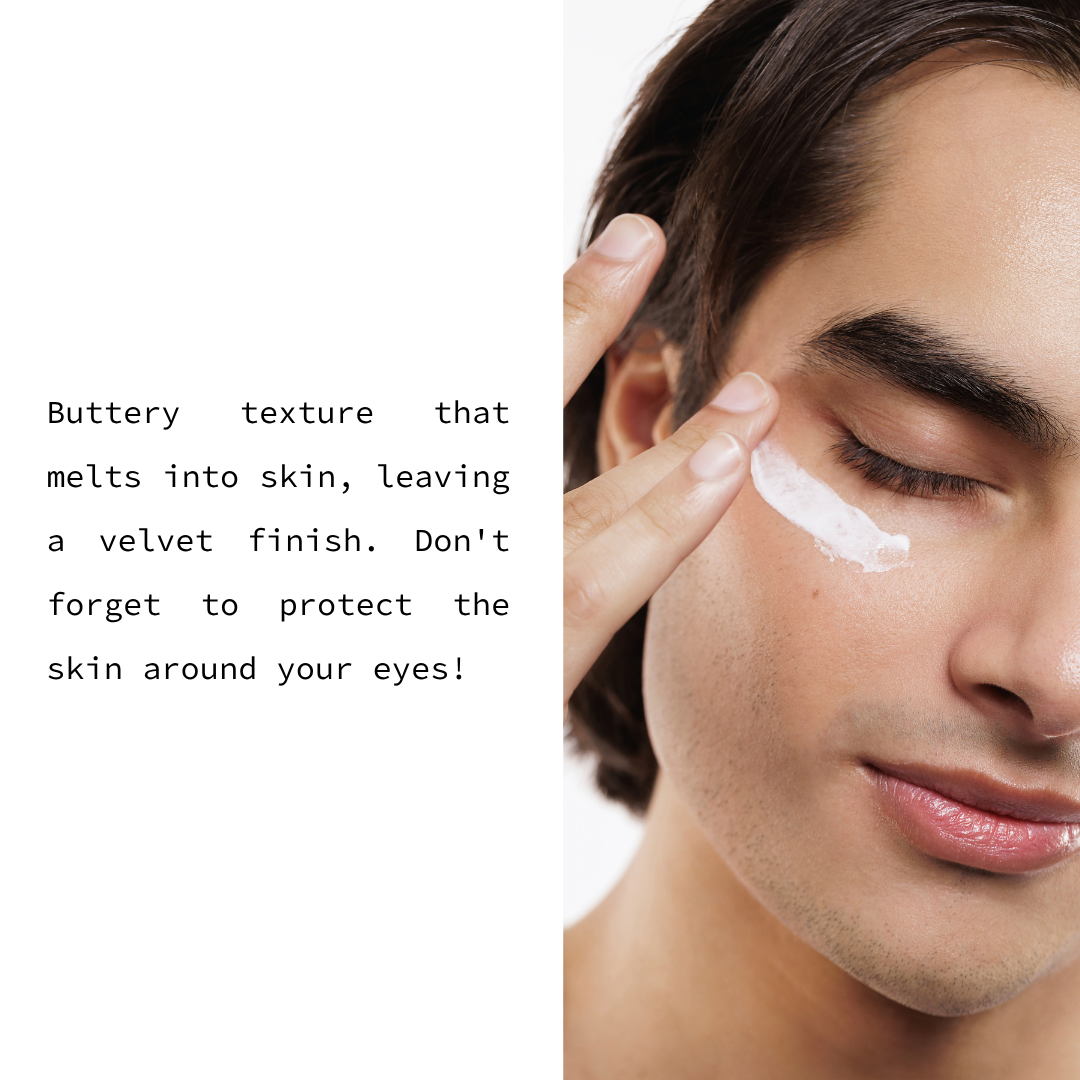 A close-up of a man applying white cream to his eye area, with text on the left describing the buttery texture and velvet finish of the skincare product.
