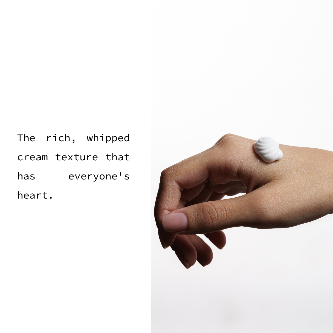 A hand with a dollop of thick white whipped cream on the back of the hand, next to text that reads, 'The rich, whipped cream texture that has everyone's heart.' on a white background.
